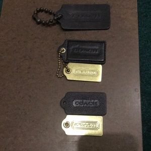 Black and brass tag